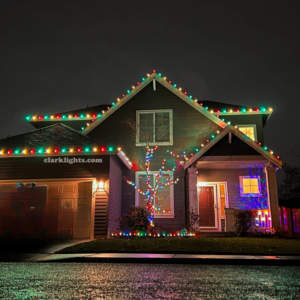 christmas lights on two=story home red, green, white Christmas light pattern by Clark Lights in Vancouver, Washington area. Call 360-207-5664 to schedule a consultation!